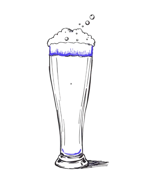 Tall pint glass with rising orange foam